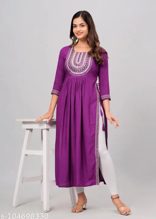 Teal blue rayon Anarkali kurti with intricate embroidery, perfect for casual or special occasions. Available in sizes S-XXXXL with precise measurements. Made in India by WUMEN KURTIS ANARKALI GAUN MENUFECING MA SYLA GARMENTS