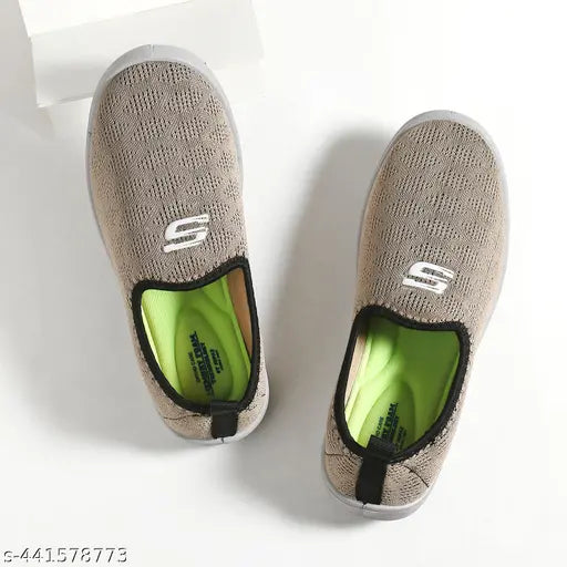 Tan and black canvas sneakers, white soles