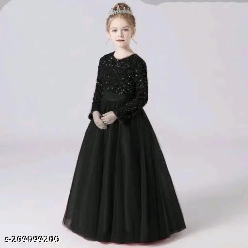 Black tulle ball gown with a sparkling crown on a child's head