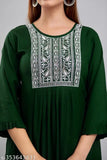 Dark green embroidered rayon kurti for women, ideal for parties and events. Three-quarter sleeve length." (123 characters)