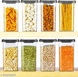 8 clear plastic storage containers with black lids, ideal for pantry organization.