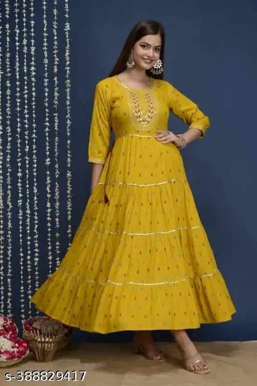 A variety of yellow embroidered kurtis with intricate designs, perfect for formal occasions