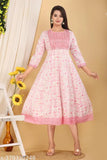 A woman in a vibrant chamki print anarkali with embroidery