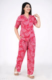 Women's printed rayon night suit top and pajama set, short-sleeved print design on display rack