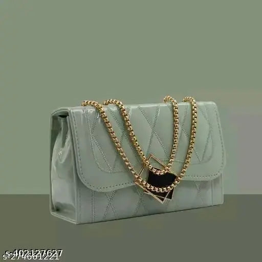 Fashionable womens sling bag, black leather with multiple pockets, gold chain accent