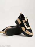 Black and gold sports shoes with white laces