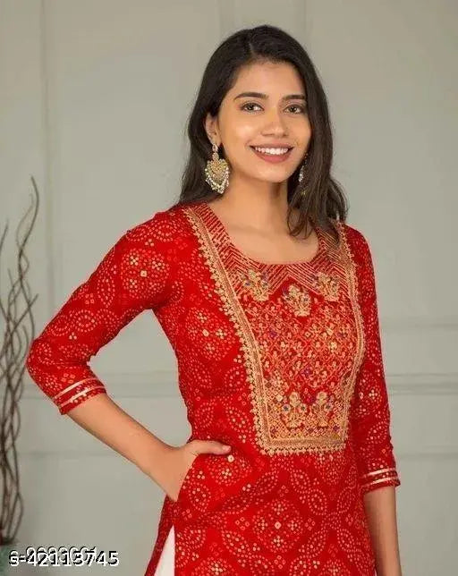 Red embroidered kurta with matching sharara, intricate border detailing