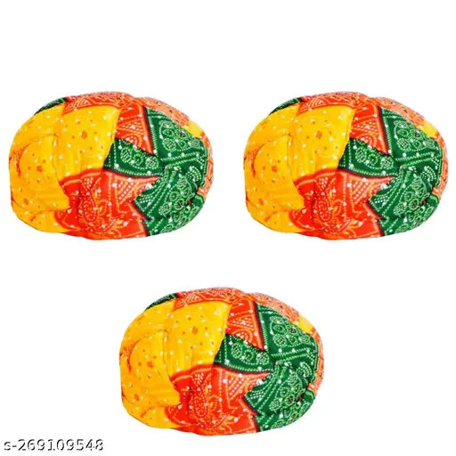 This is an image of a colorful, intricately designed traditional royal turban, also known as a pagdi, which appears to be a part of a set for three. It features vibrant colors and patterns that are indicative of the saffa style, commonly associated with festive occasions such as marriage, mahendi ceremonies, and Holi celebrations. The turban is handcrafted and originates from Rajasthani culture, which suggests it may be made in a traditional manner using techniques specific to that region