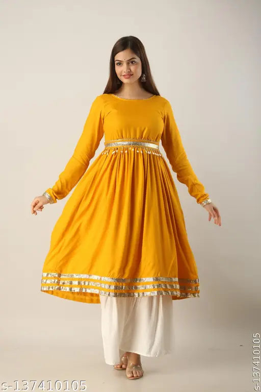 Yellow rayon kurta and sharara set with embroidery details