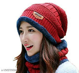 Maroon knit cap with fur lining and two ear tags, worn by a smiling woman