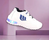 White shoes with blue accents, light-up details, and velcro closures