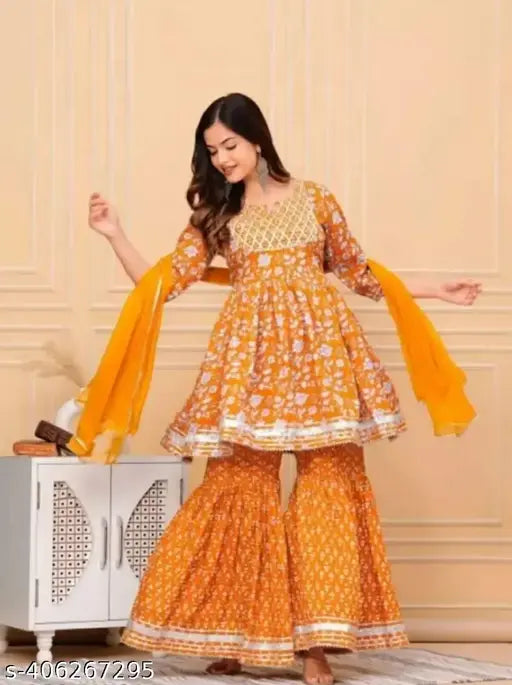 Mustard rayon sharara set with duppatta and bottomwear, printed with Gota work. High-quality ethnic Indian wear for weddings or festivals, available in sizes S to XXL. Made in India