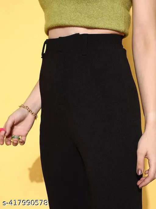 Black faux leather high waist pants with a green crop top