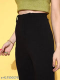 Black faux leather high waist pants with a green crop top