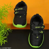 Black sports shoes for kids with neon green laces