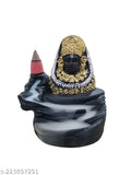 This is an image of a decorative incense holder with the statue of Lord Shyam and 10 cones of incense. It has a shiny, golden finish. The holder features a figure at the bottom with a stick of incense on it. The item appears to be made of metal and is adorned with gold accents. The backflow cone design suggests that the holder is intended for use with specific types of incense cones