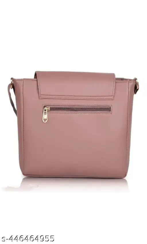 A peach crossbody sling bag with a single outer zipper pocket and double handles
