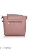 A peach crossbody sling bag with a single outer zipper pocket and double handles