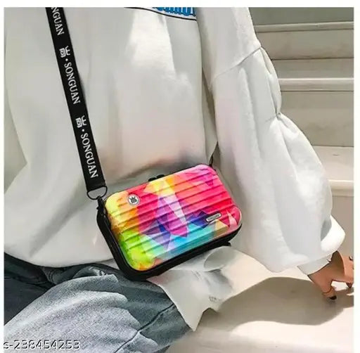 A colorful, fabric sling with a vibrant print, designed as a fashionable crossbody bag, ideal for casual outings
