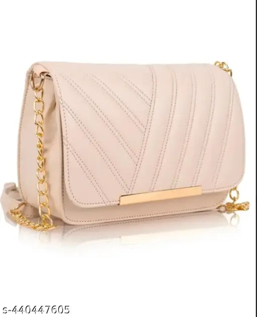 Trendy designer cream crossbody sling bag with gold chain accents, featuring multiple pockets and compartments