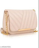 Trendy designer cream crossbody sling bag with gold chain accents, featuring multiple pockets and compartments
