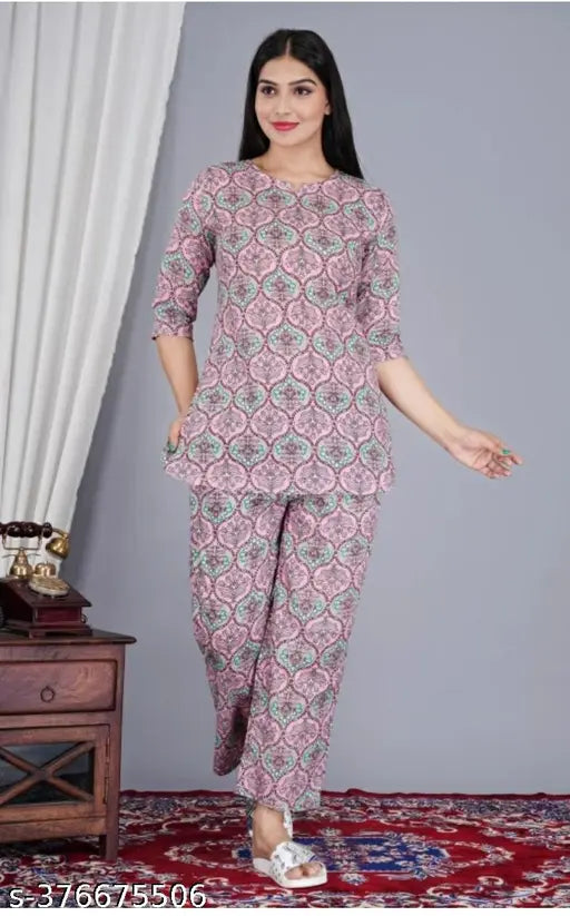 Women's rayon pink printed night suit top and pyjama coord set, floral print, round neck, three-quarter sleeves. Soft rayon fabric for comfortable sleepwear made in India