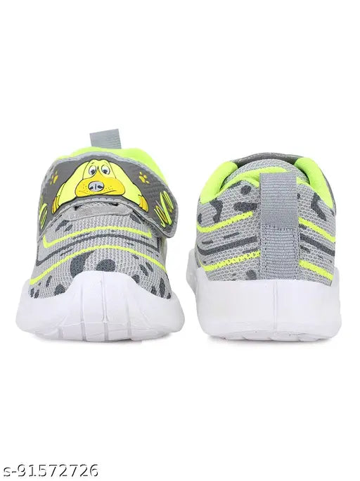 Neon yellow, black and white kids' shoes with a cartoon character on the strap