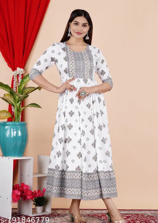 White rayon Anarkali border printed kurta with tassels, three-quarter sleeves, flared silhouette - Indian traditional wear