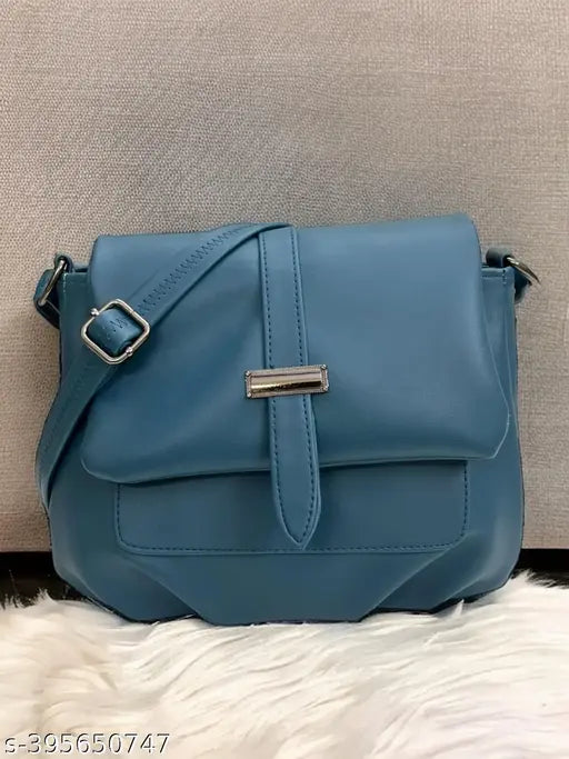 Teal leather sling bag with side pockets, adjustable shoulder strap