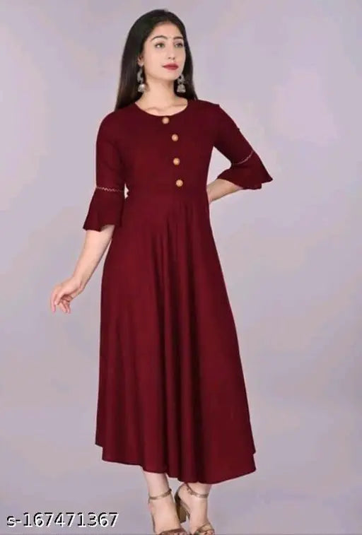 Red kameez with ruffled sleeves, embroidered neckline, and flared skirt