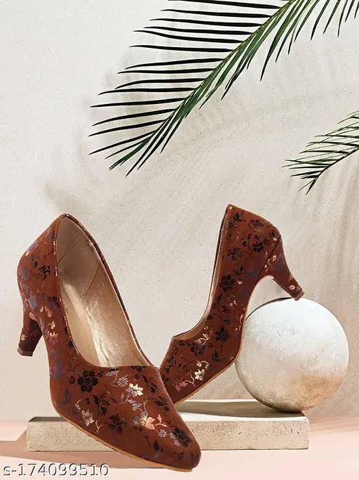 Stylish synthetic leather printed pencil heel pumps for women and girls, trending anti-skid footwear on fashionable feet
