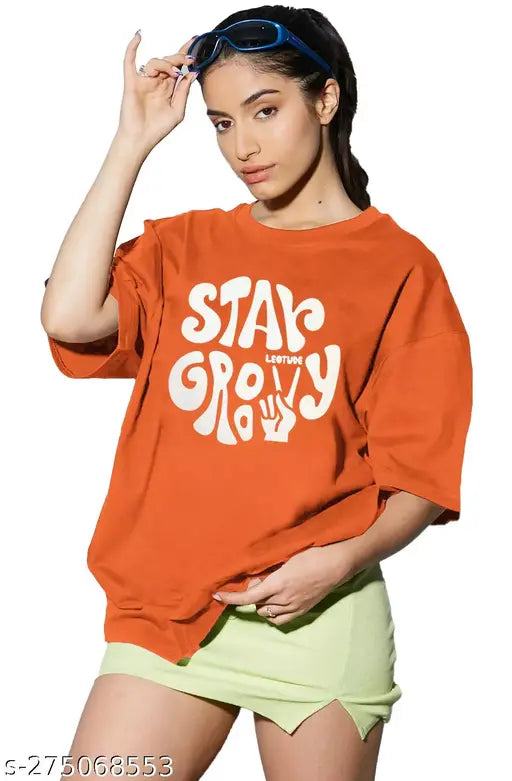 Oversized orange T-shirt with trendy printed typography for women. Round neck style. Plus size available
