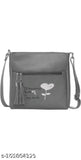 Black leather slingbag with keychain and heart design, 1 main compartment
