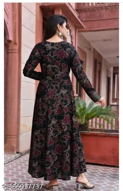 V-neck printed long anarkali kurta, sleeves 3/4 length, straight hem, black and red print on dark fabric