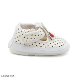 White multicolored boys booties with laces and stars