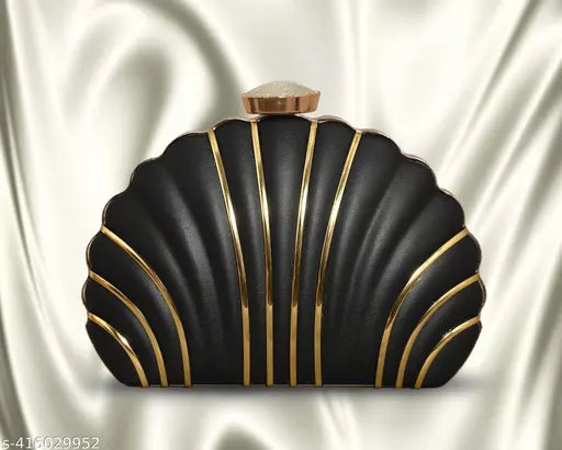 Gold and black clutch purse with a shell design on fabric