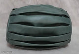 A green sling bag with a textured design, suitable for women and girls