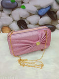 Pink satin clutch with gold chain accent