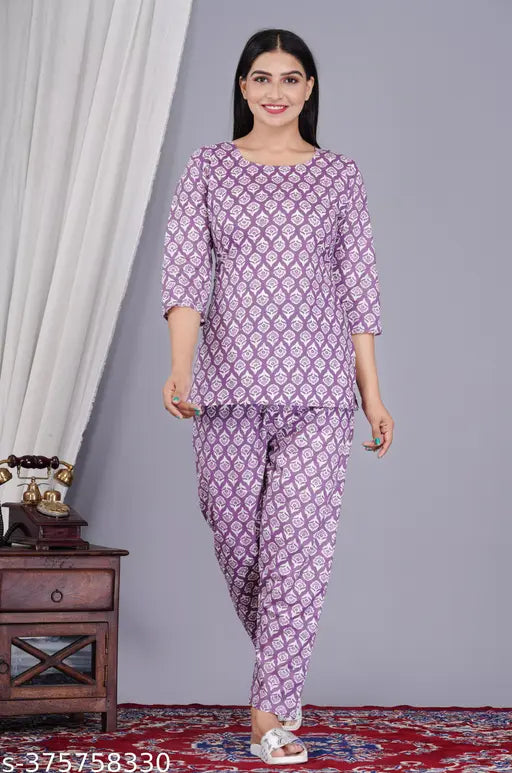 Purple cotton coord set for women, includes top & pyjamas with three-quarter sleeves and printed pattern. High-quality accessory set for versatile style, crafted in India