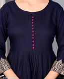 A navy blue rayon long-sleeved kameez with gold embroidery on the front and a small red button detail
