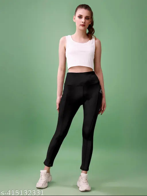 Black polyester active tights with self-design net, high waist for yoga, gym, sports, Zumba, dance, running. Comfortable, stretchy, and breathable, perfect for work and gym. Made in India