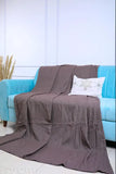 Grey cotton throw blanket, size 66 x 90 inches, covers a single bed