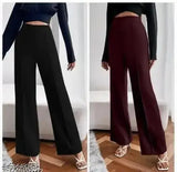 Black high-waisted jumpsuit with wide trousers, long sleeves and belted waistband