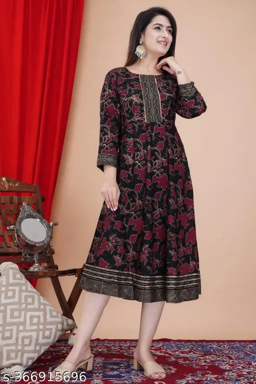 Golden printed Anarkali kurti in rayon fabric with three-quarter sleeves and intricate prints, model wearing size M