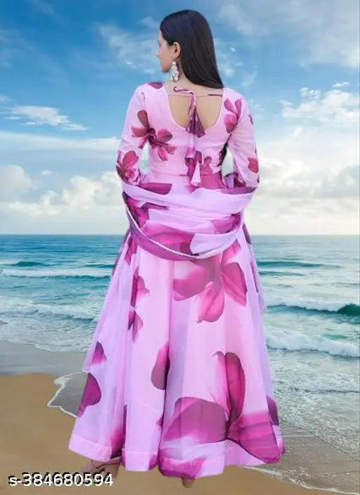 Modern Floral Pink Georgette Gown - Indian long sleeved bridal or party wear dress for women, featuring printed net design. High-quality fabric and fashion-forward design for 2023 events
