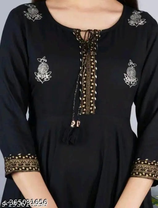 Black long-sleeved blouse with a deep V neckline, intricate border detailing on the left chest area
