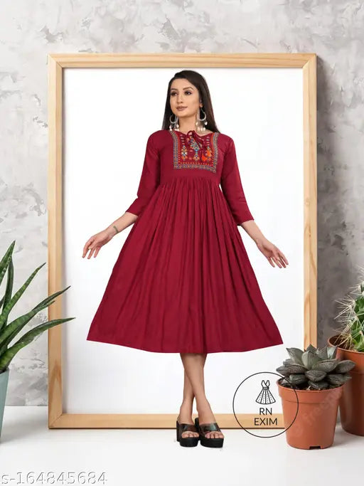 Women's solid embroidered viscose rayon A-line kurta, three-quarter sleeves. Rayon fabric, stylish Indian fashion. Soft, soothing, all-season wear