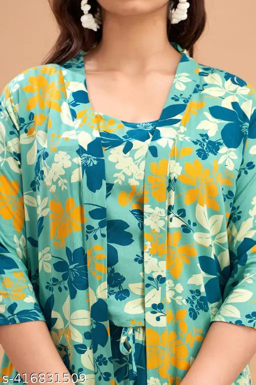 Green rayon 3-piece shirt and pyjama set with printed net pattern, featuring three-quarter sleeves. High-quality fabric from India