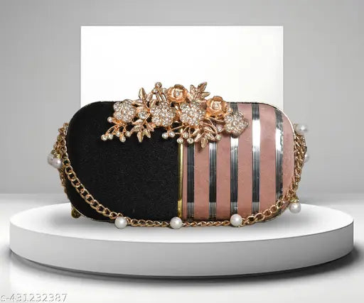 Black clutch with gold accents, featuring pearls and black fabric