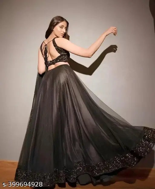 Black velvet lehenga Choli with net bottom and dupatta, embellished top on display stand